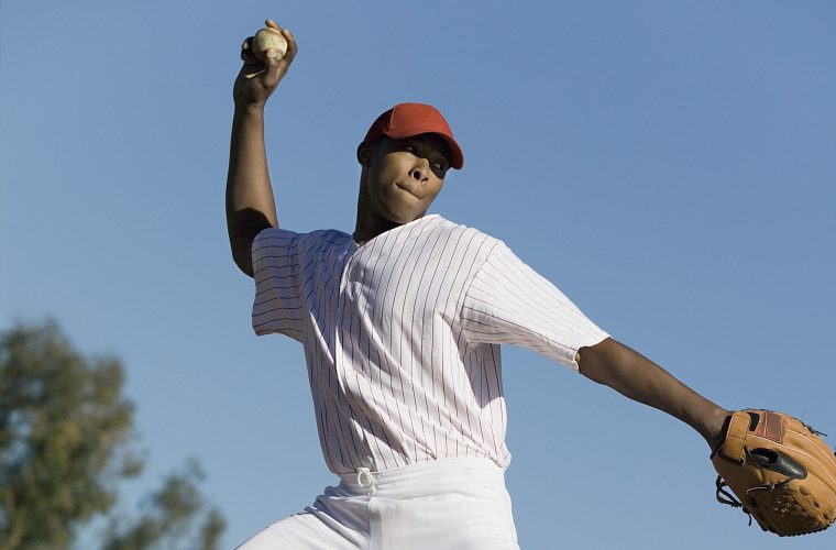 Sportsman throwing a ball.